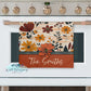 Floral towel with 'The Smiths' text on a white stove